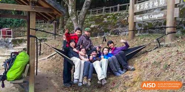 Students and teachers relaxing outside during a school activity at Yew Wah International Education School of Shanghai Lingang.