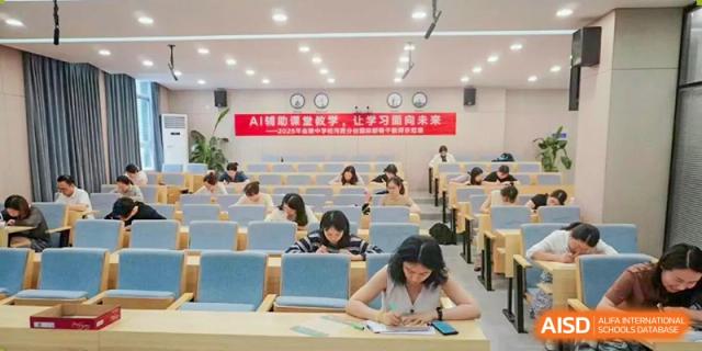 Students from International Department of Jinling High School Hexi Campus studying or taking a test in a large, quiet classroom or examination hall.