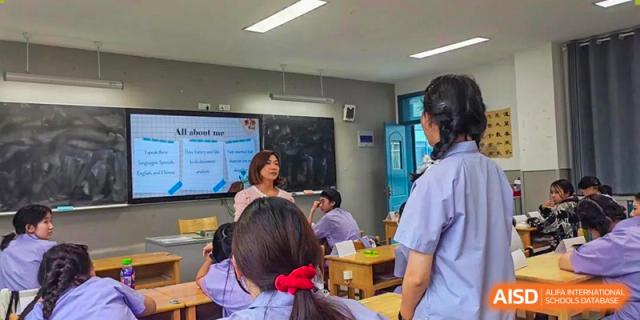 Students and an instructor from International Department of Jinling High School Hexi Campus engaged in a classroom discussion or activity.