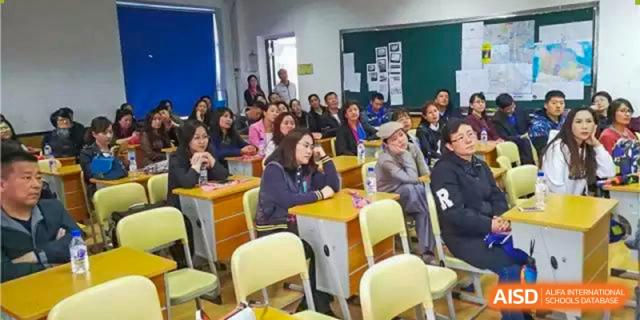 A group of students seated in a classroom, attentively listening to a lecture or presentation. Canada British Colombia International Schools-Hefei.