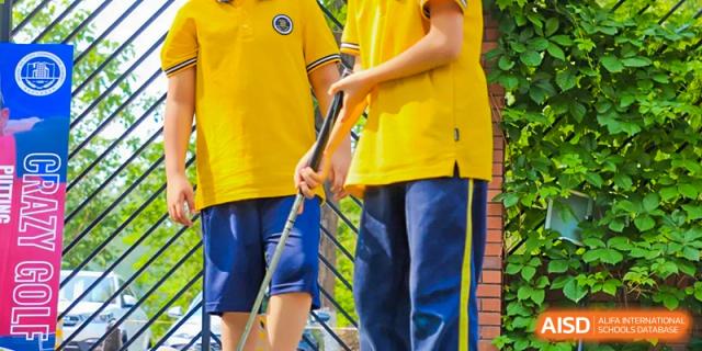 A close-up shot of students' legs as they participate in a sports game at Beijing Xin Fuxue International Academy.