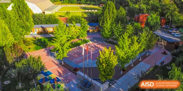 An aerial view of the campus grounds and sports courts at Beijing Xin Fuxue International Academy.