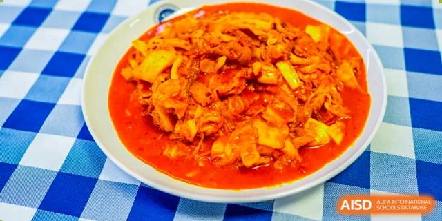 A plate of a spicy, stir-fried dish, a meal option at Beijing Xin Fuxue International Academy.