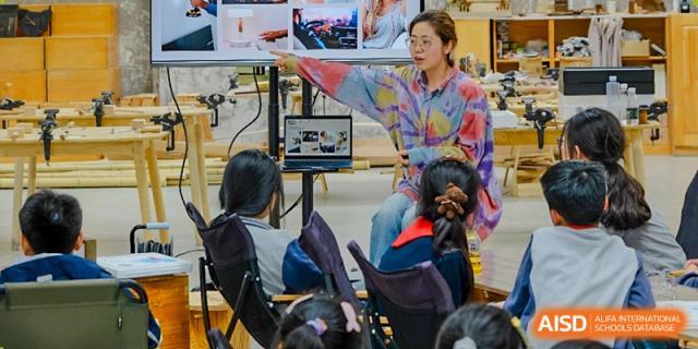 A group of students from Xi'an Jiaotong-Liverpool University Affiliated School (XJTLU-AS) are participating in an in-class activity.