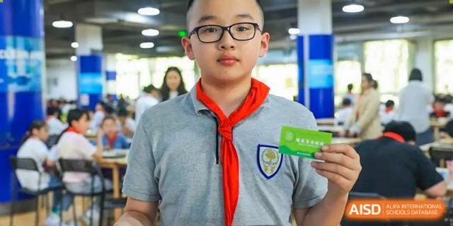 A student from Xi'an Jiaotong-Liverpool University Affiliated School (XJTLU-AS) is posing for a headshot.