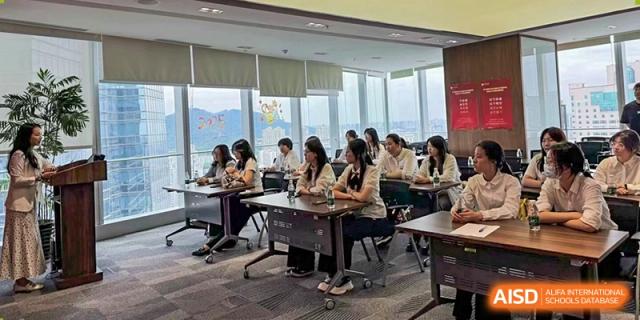 A classroom of students seated at desks, actively engaged in a lesson with a bright view of the outdoors at Wuxi No.1 High School.