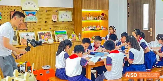 A group of young students in a bright classroom or study area collaborating on school work at Wuxi No.1 High School.