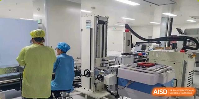 A large, modern piece of industrial or technical machinery in a specialized lab or workshop at Wuxi No.1 High School.