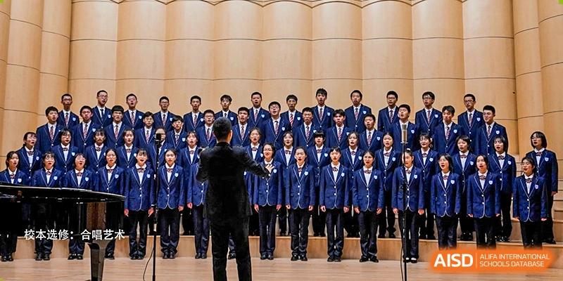 The school choir, dressed in blue uniforms, performing on stage with a conductor during a concert or event at Wuxi No.1 High School.