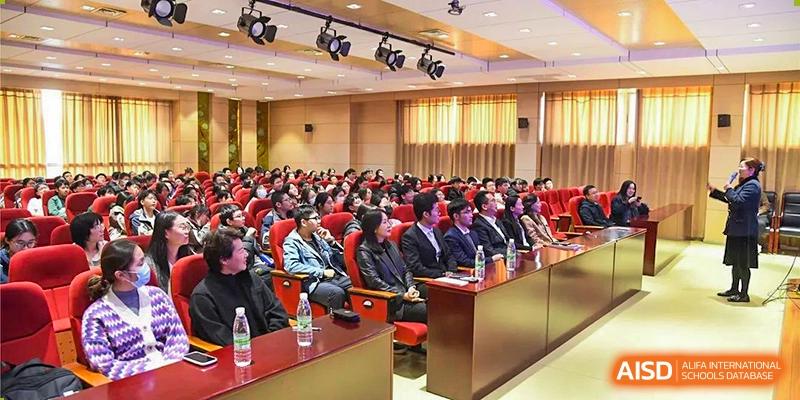 A large audience of students and faculty seated in an auditorium listening to a lecture or presentation at Wuxi No.1 High School.