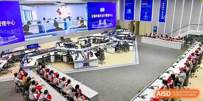 An overview of a modern university counseling or resource center with many computer workstations and screens at Wuxi No.1 High School.