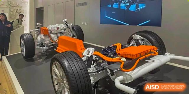 A close-up view of a high-performance car engine and wheel. Chengdu Shishi Tianfu High School International Department.