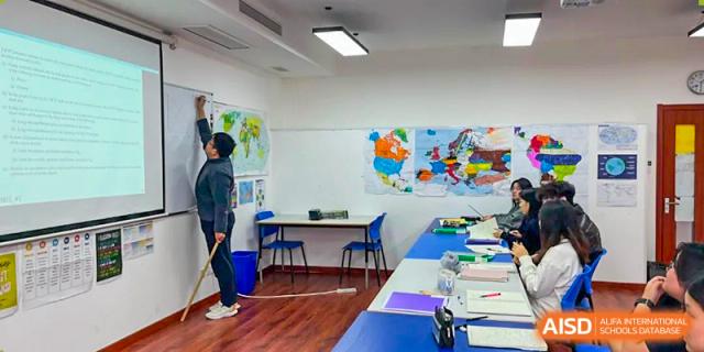 A bright classroom with students in the background at BaiShan AWS High School.
