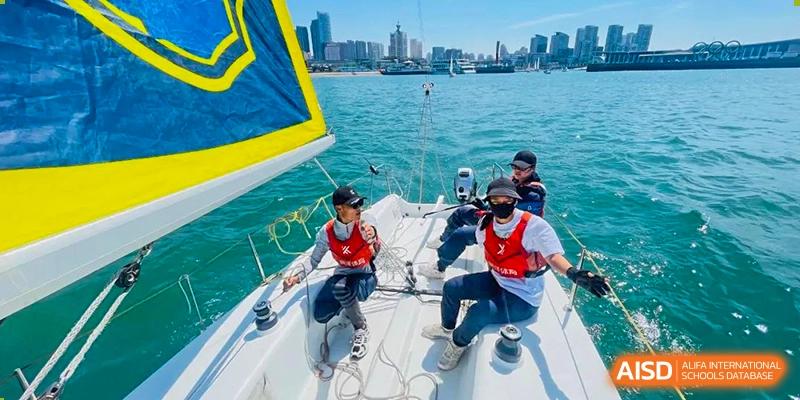 BaiShan AWS High School students sail on a boat trip.
