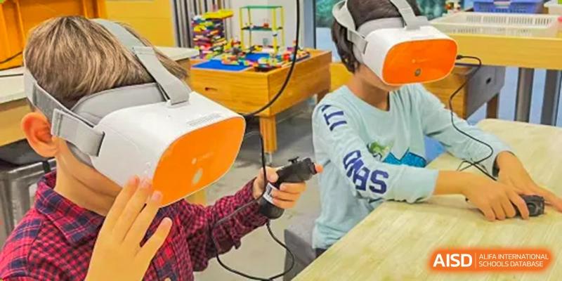A student at Shanghai American School is wearing a virtual reality headset and holding controllers during a technology event.