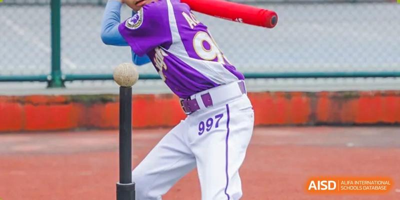 A close-up of a Cogdel Cranleigh School Changsha student's uniform during a baseball game, showing a purple jersey and the number 997.