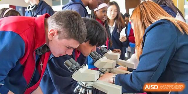 AISB-Hope International students learning science by closely examining specimens using microscopes.