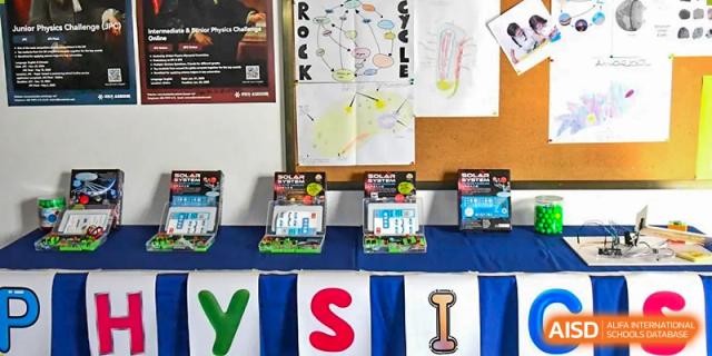 A colorful academic display at AISB-Hope International, featuring educational materials and banners.