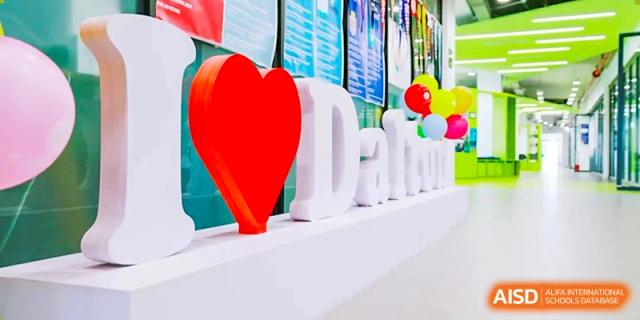 A close-up of a decorative sign featuring a large red heart and the name "Dalton," representing the spirit of The Affiliated High School of Peking University's Dalton Academy.
