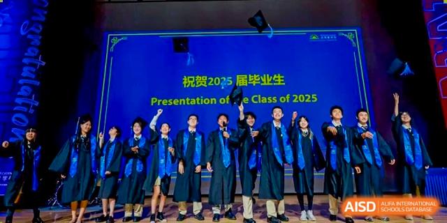 DAYSTAR ACADEMY graduates in blue robes cheering and celebrating on stage at their graduation ceremony.