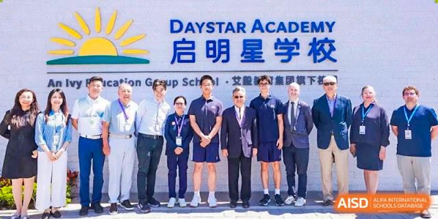 A group of male students and staff posing for a photo at a DAYSTAR ACADEMY event.