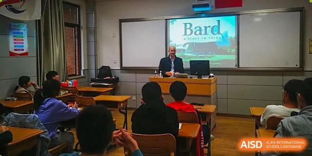 An international visitor or speaker giving a presentation to a class of students in a classroom at Wuxi No.1 High School.