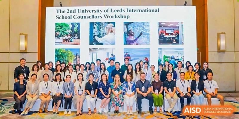 A large group photo of students and international counselors attending the University of Leeds International Counsellors Workshop at Wuxi No.1 High School.