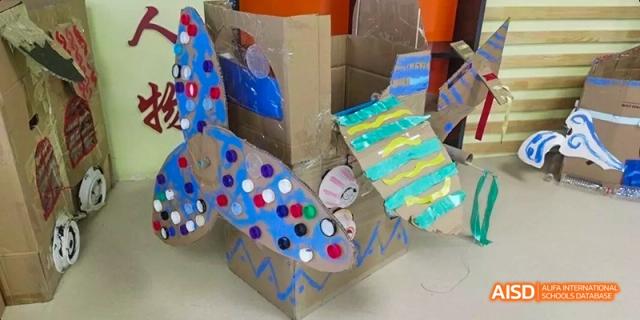 A colorful, student-made diorama or model constructed from cardboard and paint, part of an art or design project, at BDA School of The High School Affiliated to Renmin University of China.