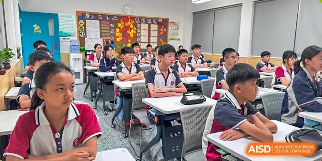 A classroom of students from The International School of Rhodes seated at desks and engaged in a lesson.
