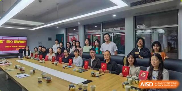 A group of students and faculty from The International School of Rhodes attending a small group meeting or workshop.