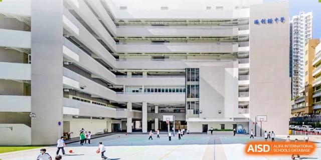 A dynamic architectural view of the modern campus buildings and open grounds of the Affiliated School of JNU for Hong Kong & Macao Students.
