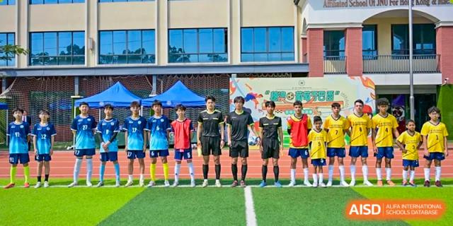 A student soccer team and coaches from the Affiliated School of JNU for Hong Kong & Macao Students lined up for a photo before or after a match.