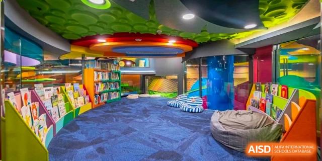 Interior view of a creatively designed reading nook or library space with comfortable seating at Changchun American International School (CAIS).