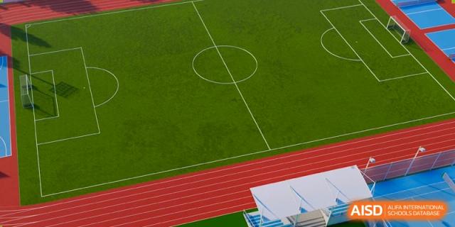 An aerial view of the well-maintained running track and green field sports facility at Haileybury Schools, Tianjin.