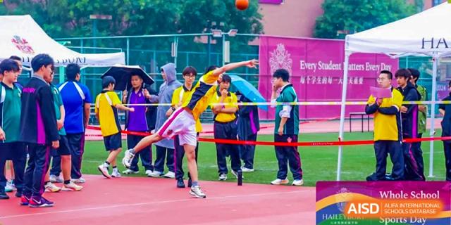 A student participating in a javelin throw event on the track field during a school sports day at Haileybury Schools, Tianjin.