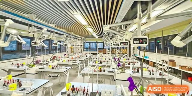 A brightly lit, modern medical or science laboratory filled with equipment, tables, and overhead lights Hefei No.6 High School  International Department.