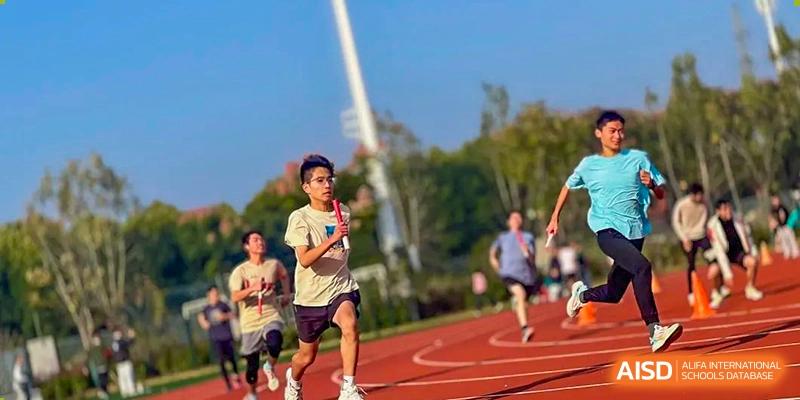 A student running on the track during a fitness class or training session at the Hefei No.6 High School International Department.