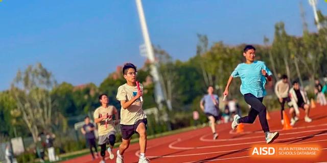 A student running on the track during a fitness class or training session at the Hefei No.6 High School International Department.