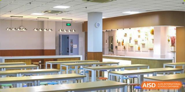 A modern, brightly lit classroom or study area at Milton International School Qingdao with flexible seating arrangements and an open-concept design.
