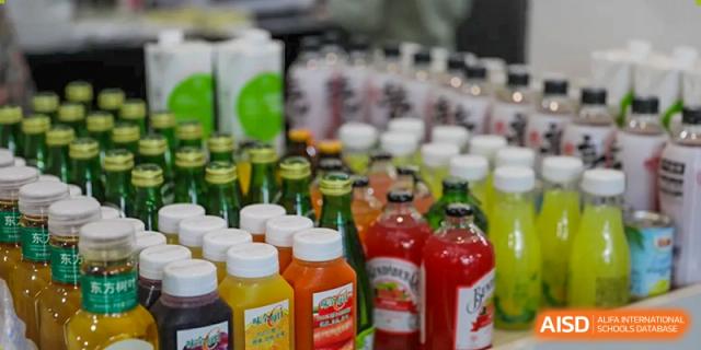 A display of bottled fresh fruit juices and beverages in a variety of bright colors at Nord Anglia International School Shanghai, Pudong.