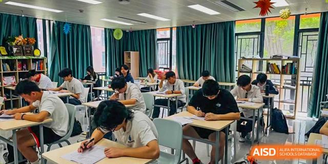 RDF International School students focused on taking a test or working individually at desks in a classroom.