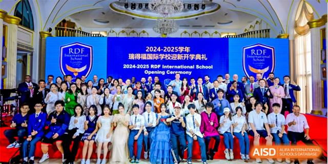 A large group of students and faculty posing together for the 2024-2025 Opening Ceremony at RDF International School.