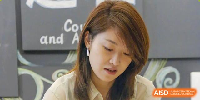 Close-up of a student concentrating and looking down during a class at RGS Guildford Nanjing.
