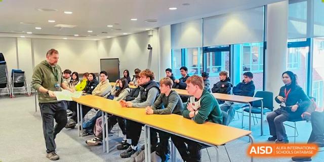 Students from RGS Guildford Nanjing and international students seated at desks in a learning seminar.