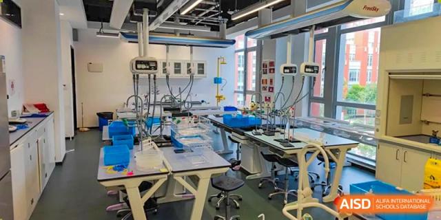 An advanced science or technology laboratory at SHENGHUA ZIZHU ACADEMY equipped with various specialized scientific instruments and devices.