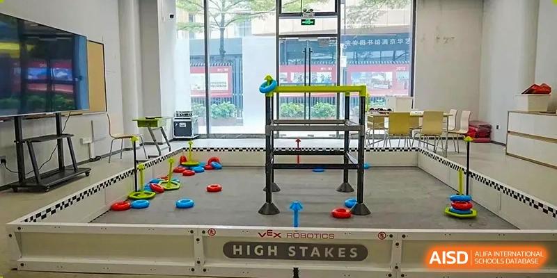 A competition field setup for a VEX Robotics 'High Stakes' challenge at Shenzhen International Foundation College (SIFC).