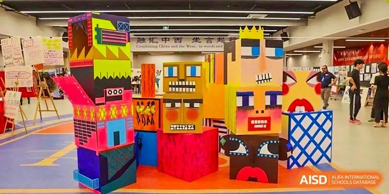 A colorful, blocky art installation or stage design possibly created by students at Shenzhen International Foundation College (SIFC).