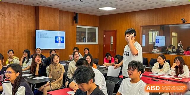 A small group of students participating in an indoor collaborative learning activity at Walton International School Xuzhou.