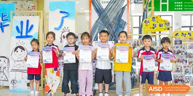 Young students from Wuxi Huatian Bilingual School in casual clothes posing with awards or certificates.