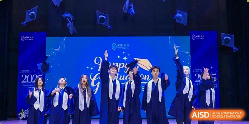 Graduating students in gowns and caps on a stage during a ceremony at Wycombe Abbey School Hangzhou.
